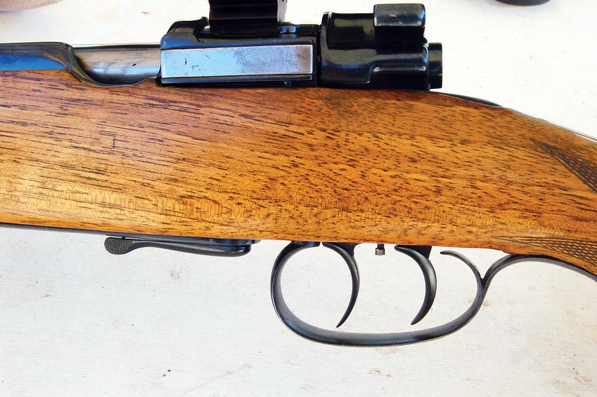 Double-set triggers and lever floorplate release with all markings removed were common gunsmith additions to military actions. Note the thumb cut in the side rail.